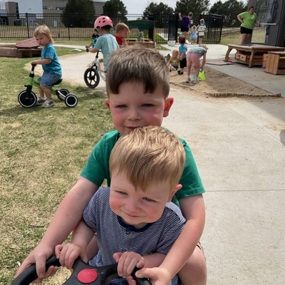 Teaching siblings how to ride the bikes.